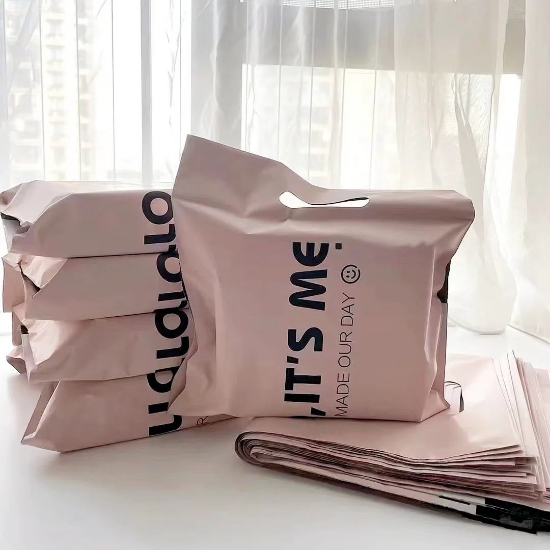 Biodegradable mailer with handles, self sealing 